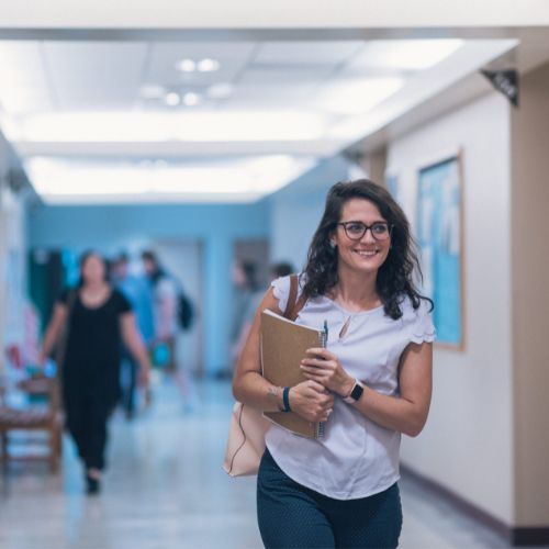 student walking in hallway