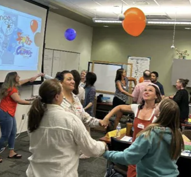 students doing a classroom activity with a balloon