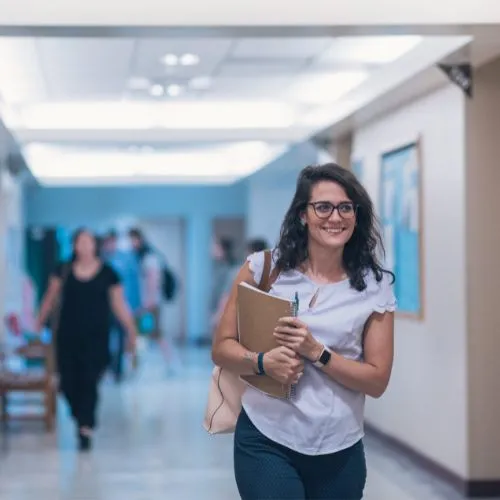 student walking through the corridor