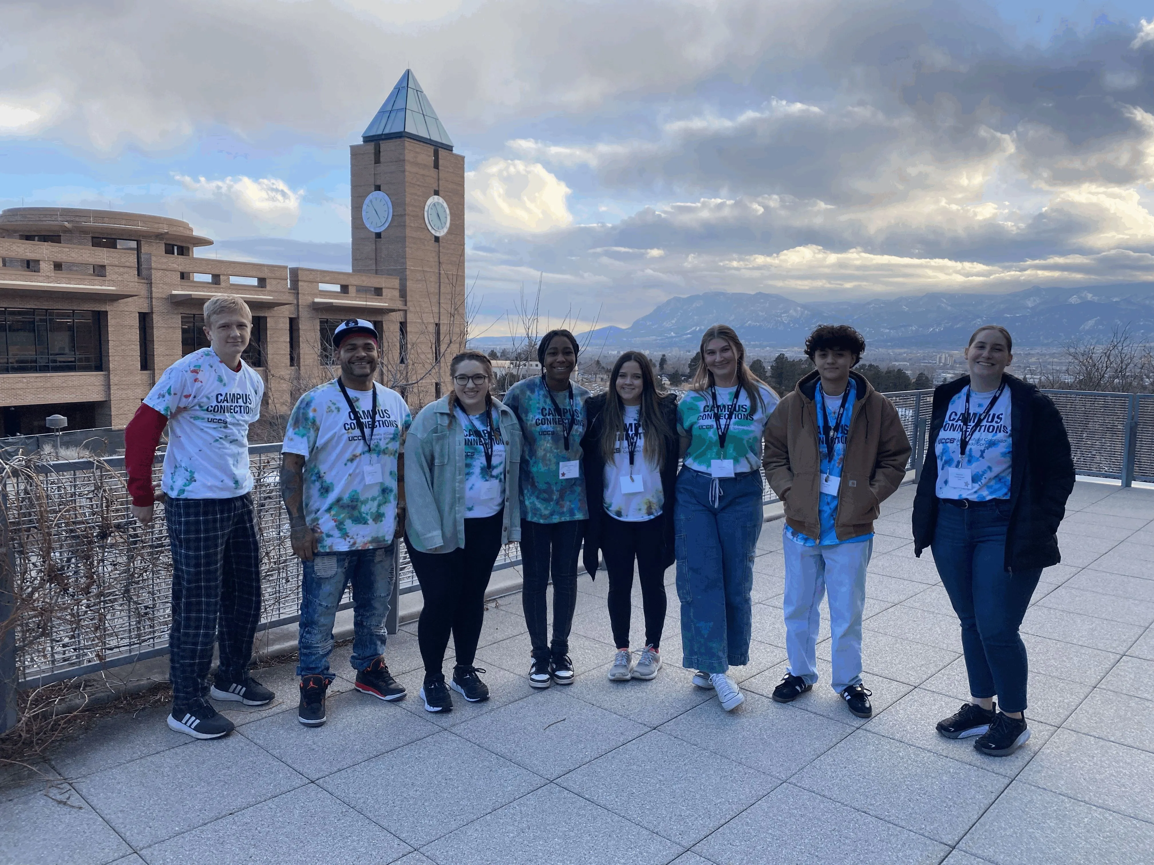 Group of mentors and mentees in front of UCCS clock tower